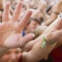 9-KIDS-HANDS-RAISED