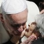 Pope accepts kiss from elderly woman during general audience in St. Peter's Square at Vatican Pope accepts kiss from elderly woman during general audience in St. Peter's Square at Vatican