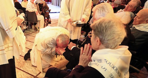 Pope Francis kisses a foot of a disabled person Our Lady of Providence Center in Rome Pope Francis kisses a foot of a disabled person Our Lady of Providence Center in Rome