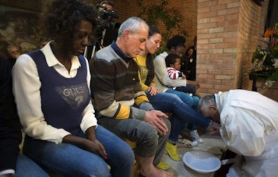 Pope Francis kisses foot of inmate at Rome prison
