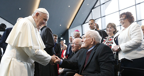 Pope Francis greet a local parishioner as he visits the Chapel of the Apparitions at the Knock Shrine in Knock, Ireland, Aug. 26. (CNS photo/Paul Haring) See POPE-KNOCK Aug. 26, 2018.