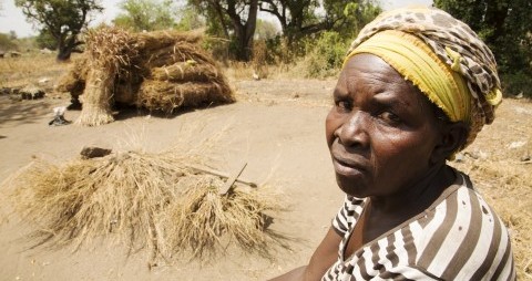 Mary Aba, 61, looking over the grave of her son, Eliazya, who died of epilepsy in the Palorinya refugee camp, close to the south sudan border, in Northern Uganda. 30.01.19